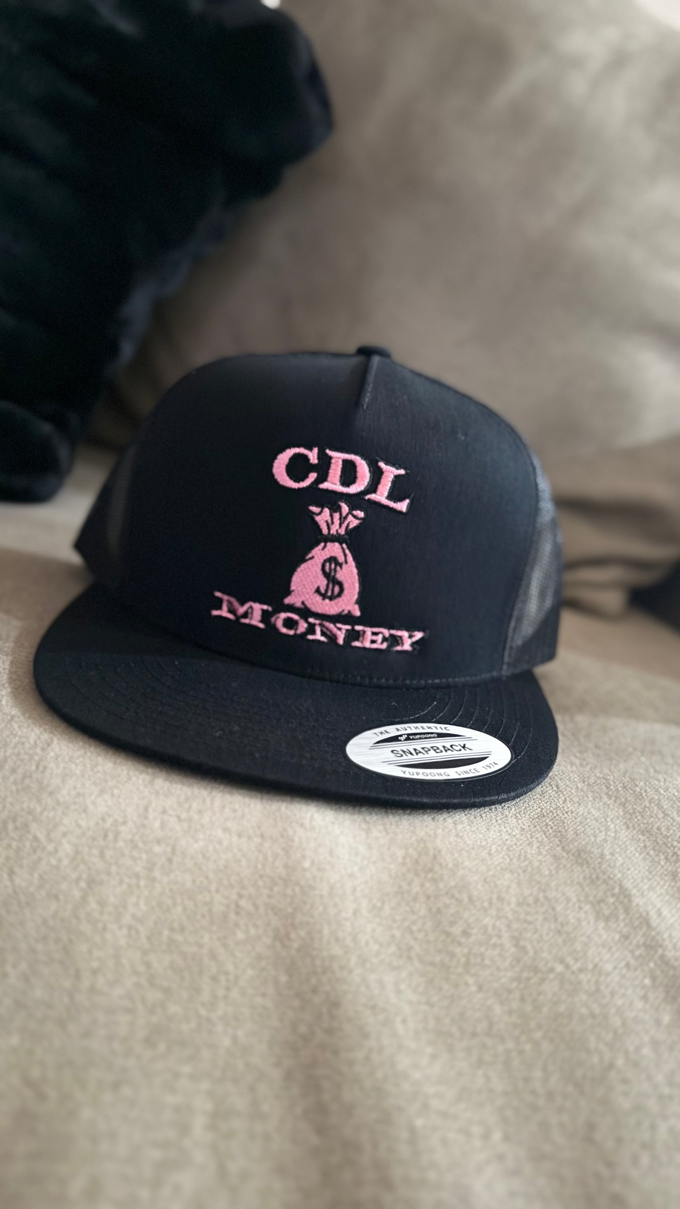 All black SnapBack with pink logo 